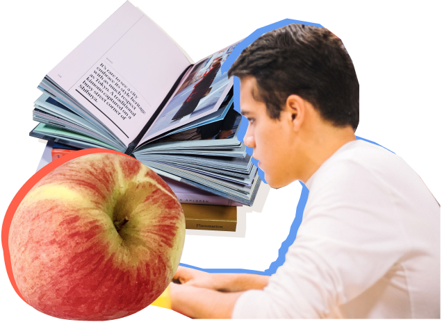 Young man with open book and apple