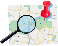 Map with magnifying glass and pin